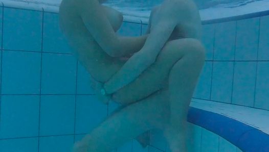 Couple is having sex underwater