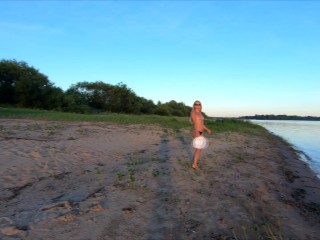 Young naked girl on beach