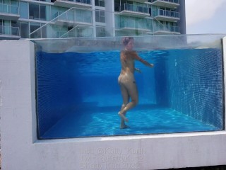 Naked underwater in pool